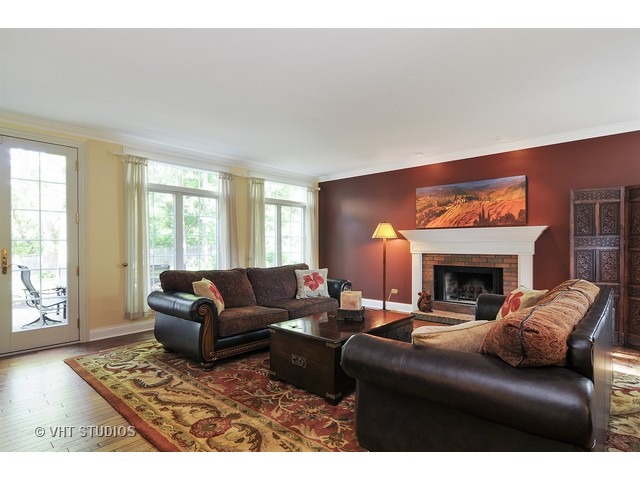 14 West Sunset Road Chicago, IL 60647 - Photo 7 of 25 a living room with furniture and a fireplace