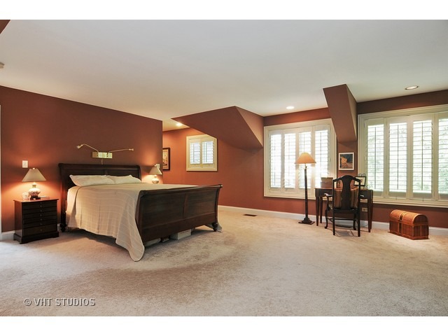 14 West Sunset Road Chicago, IL 60647 - Photo 10 of 25 a spacious bedroom with a bed and large windows