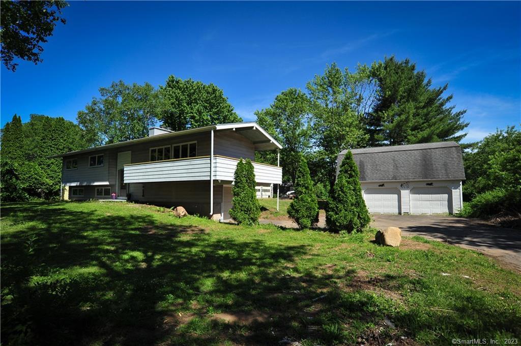 370 Merriman Road Windsor, CT 06095 - Photo 1 of 1 a front view of a house with a yard