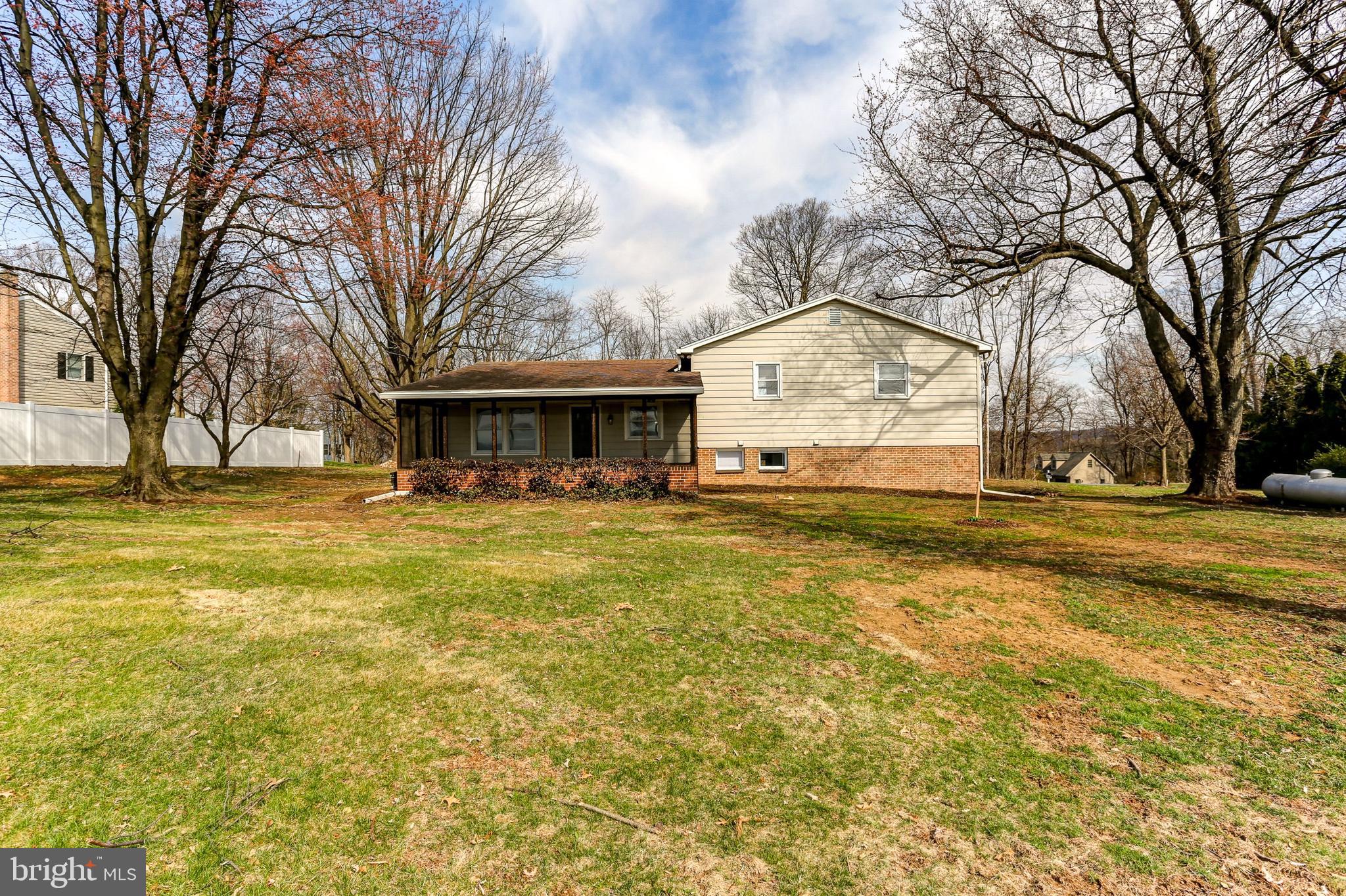 666 Shultz Road Washington Boro, PA 17582 - Photo 4 of 37 a view of house with swimming pool and trees in the background