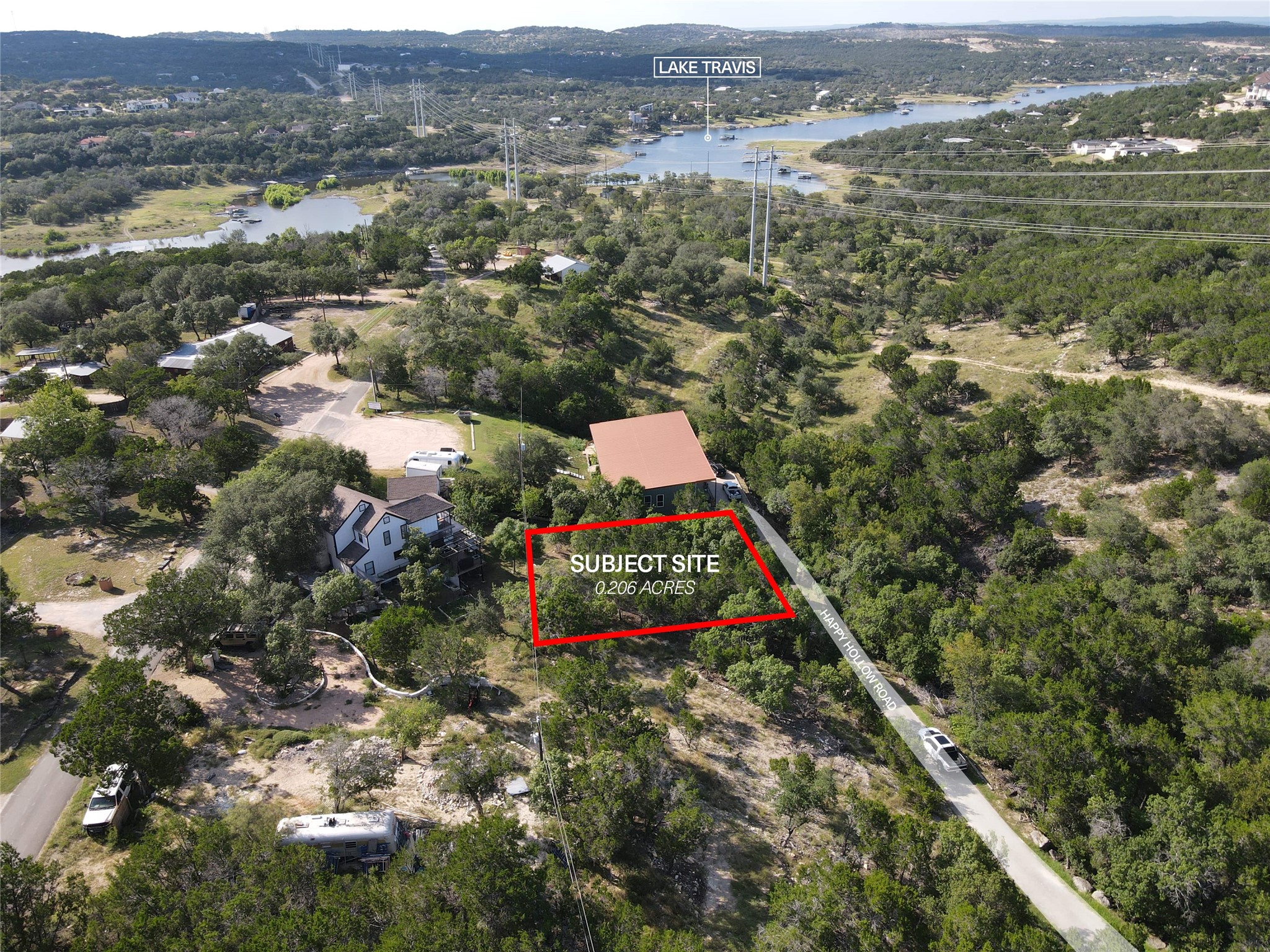 19525 Happy Hollow Road Spicewood, TX 78669 - Photo 4 of 8 an aerial view of residential houses with outdoor space and trees