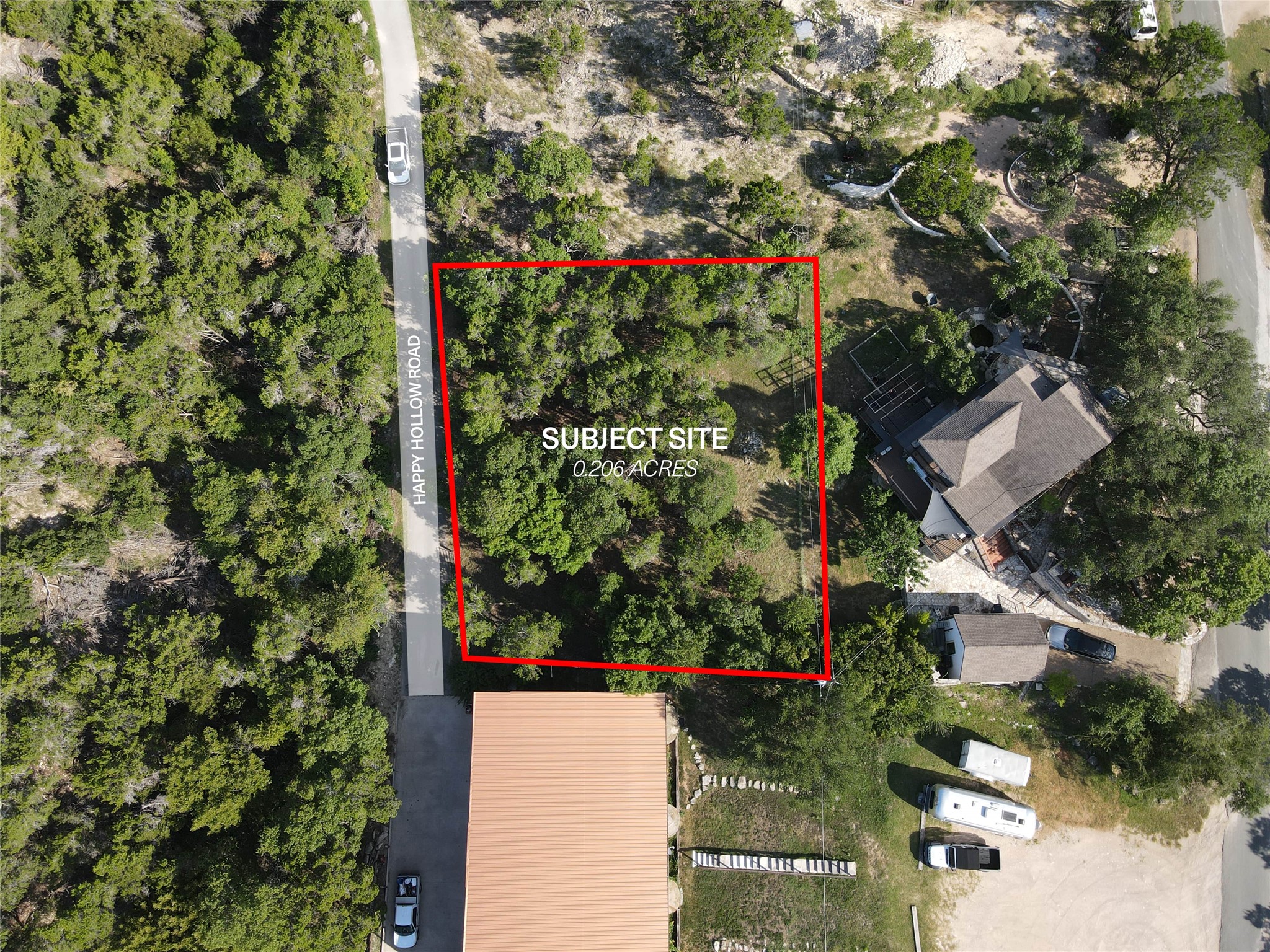 19525 Happy Hollow Road Spicewood, TX 78669 - Photo 7 of 8 an aerial view of a house with a yard