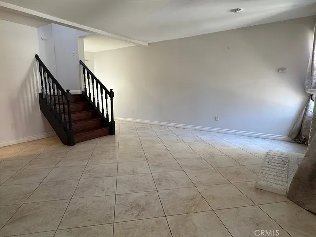 a view of an empty room with windows