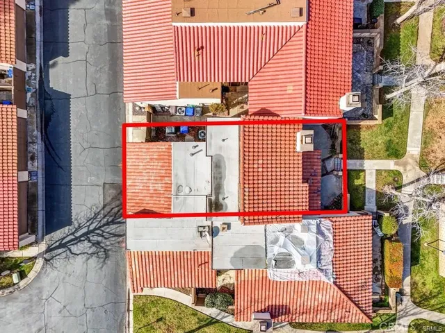 an aerial view of residential houses and outdoor space