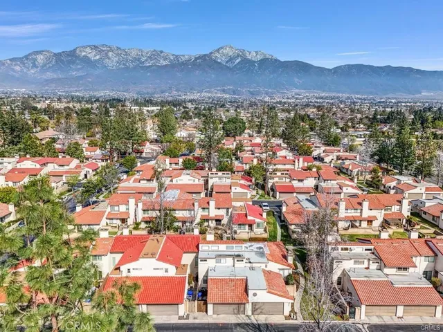 an aerial view of residential houses and outdoor space