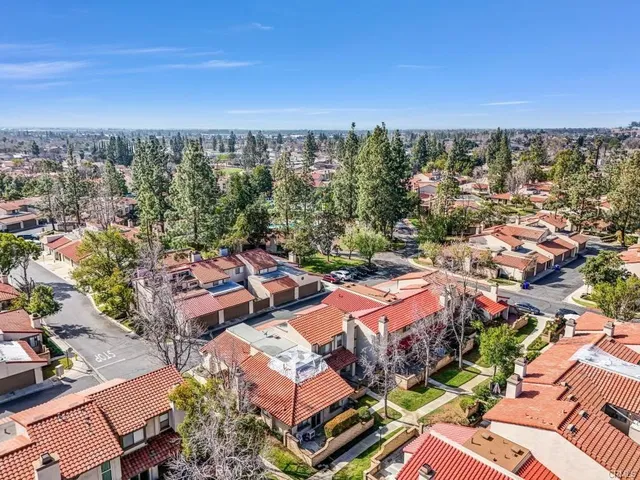 an aerial view of a city with lots of residential buildings