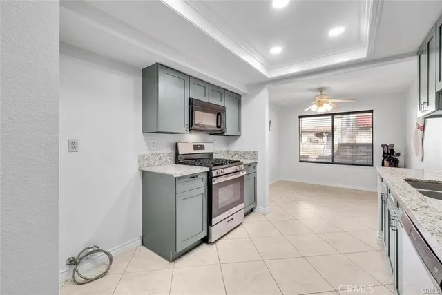 a kitchen with a stove a sink and a refrigerator