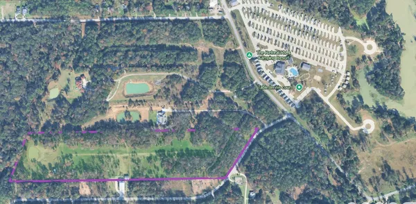 a aerial view of a house with a yard and sitting area