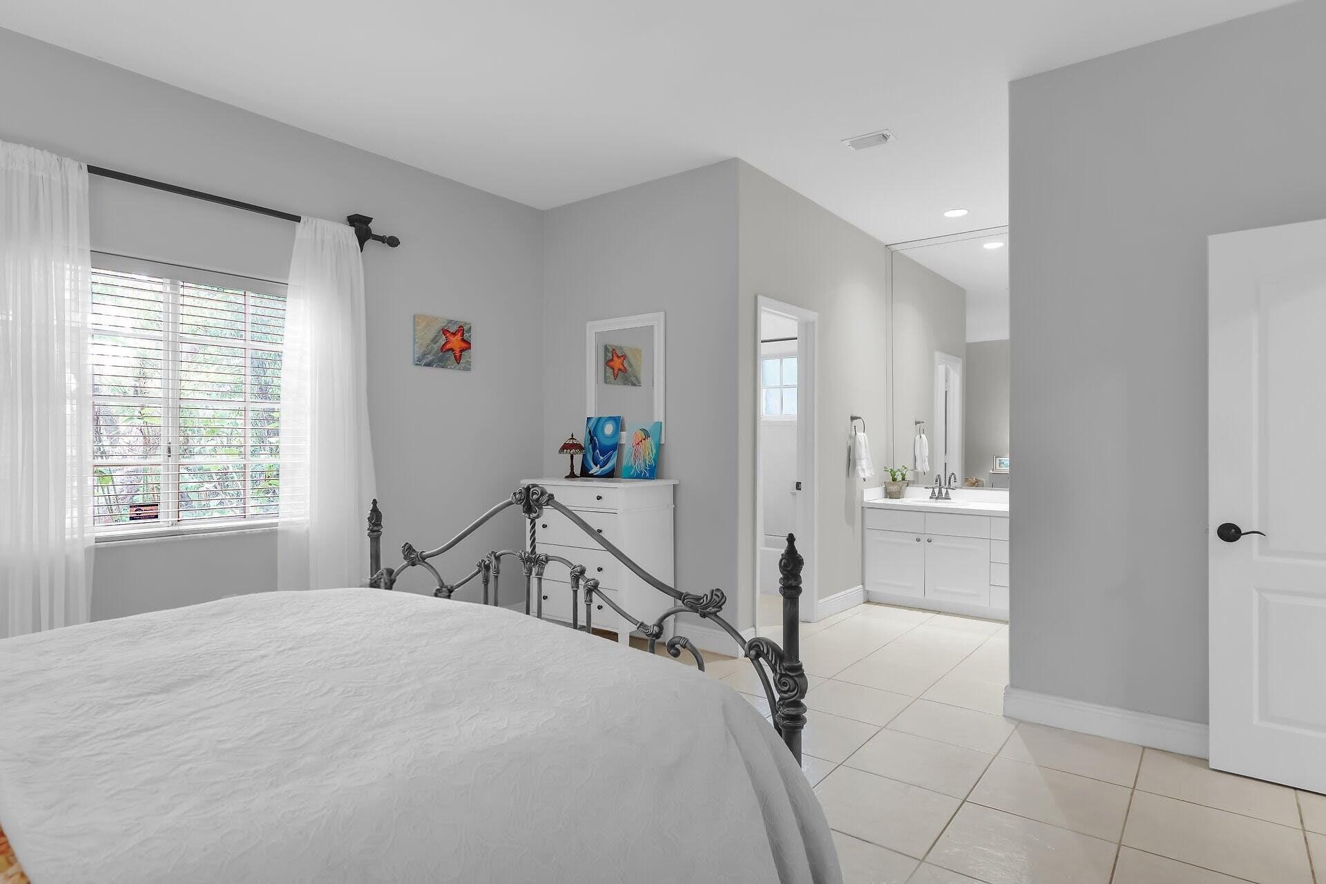 6 Fishermans Trail Key Largo, FL 33037 - Photo 16 of 50 a bedroom with a bed and a window