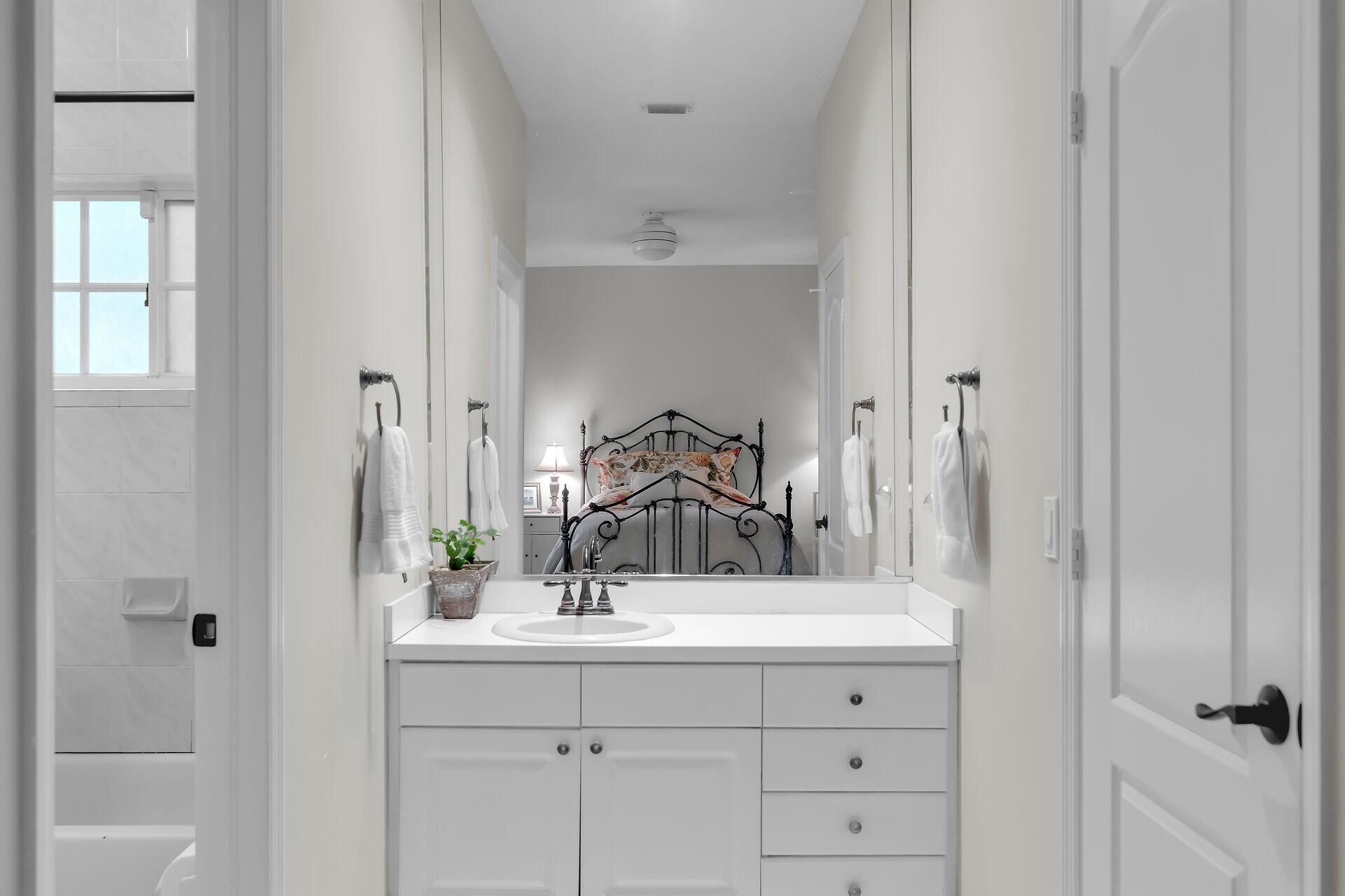 6 Fishermans Trail Key Largo, FL 33037 - Photo 17 of 50 a bathroom with a sink and a mirror