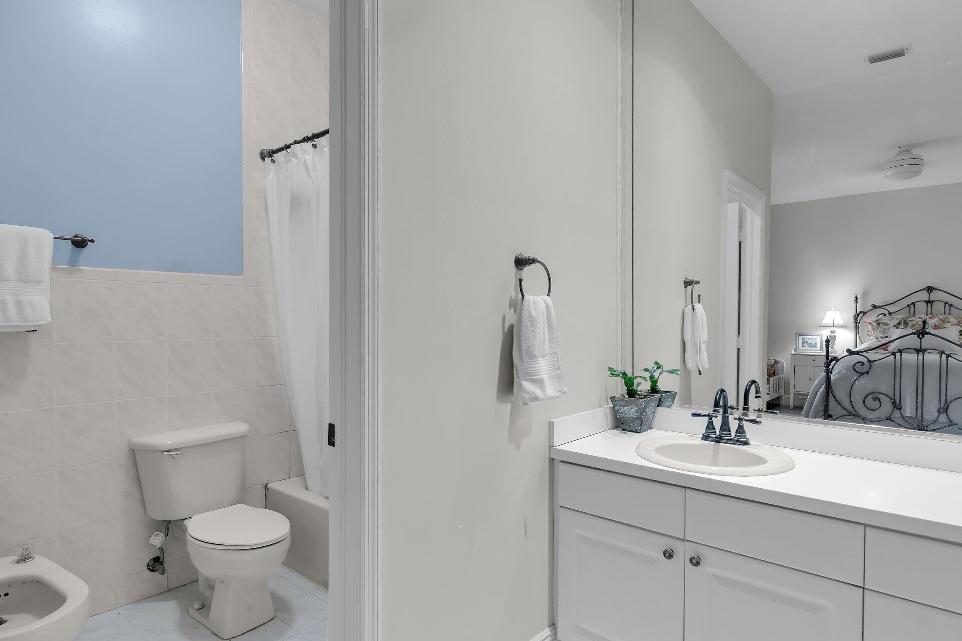 6 Fishermans Trail Key Largo, FL 33037 - Photo 18 of 50 a bathroom with a sink toilet and a mirror