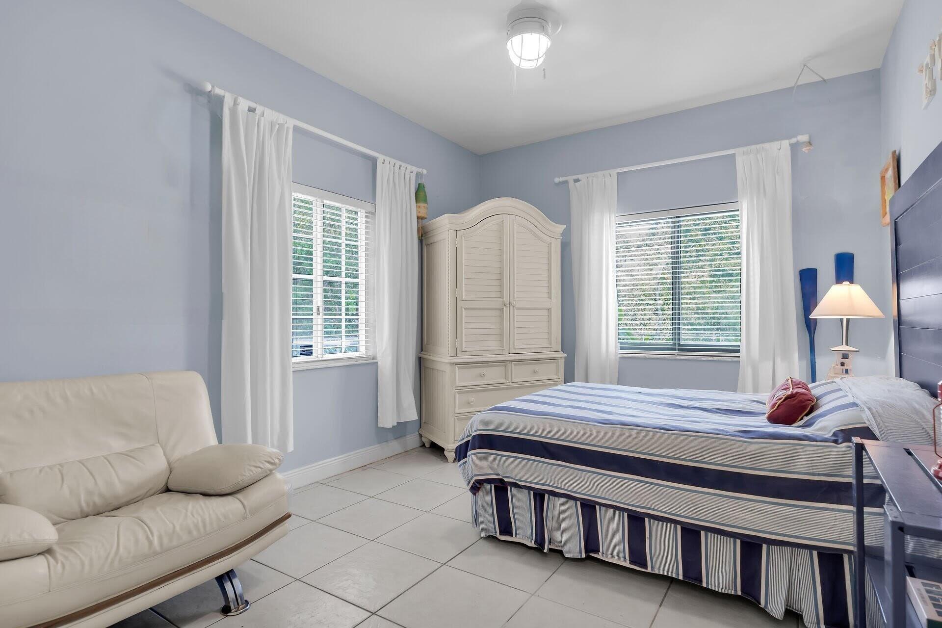 6 Fishermans Trail Key Largo, FL 33037 - Photo 20 of 50 a bedroom with bed couch and window