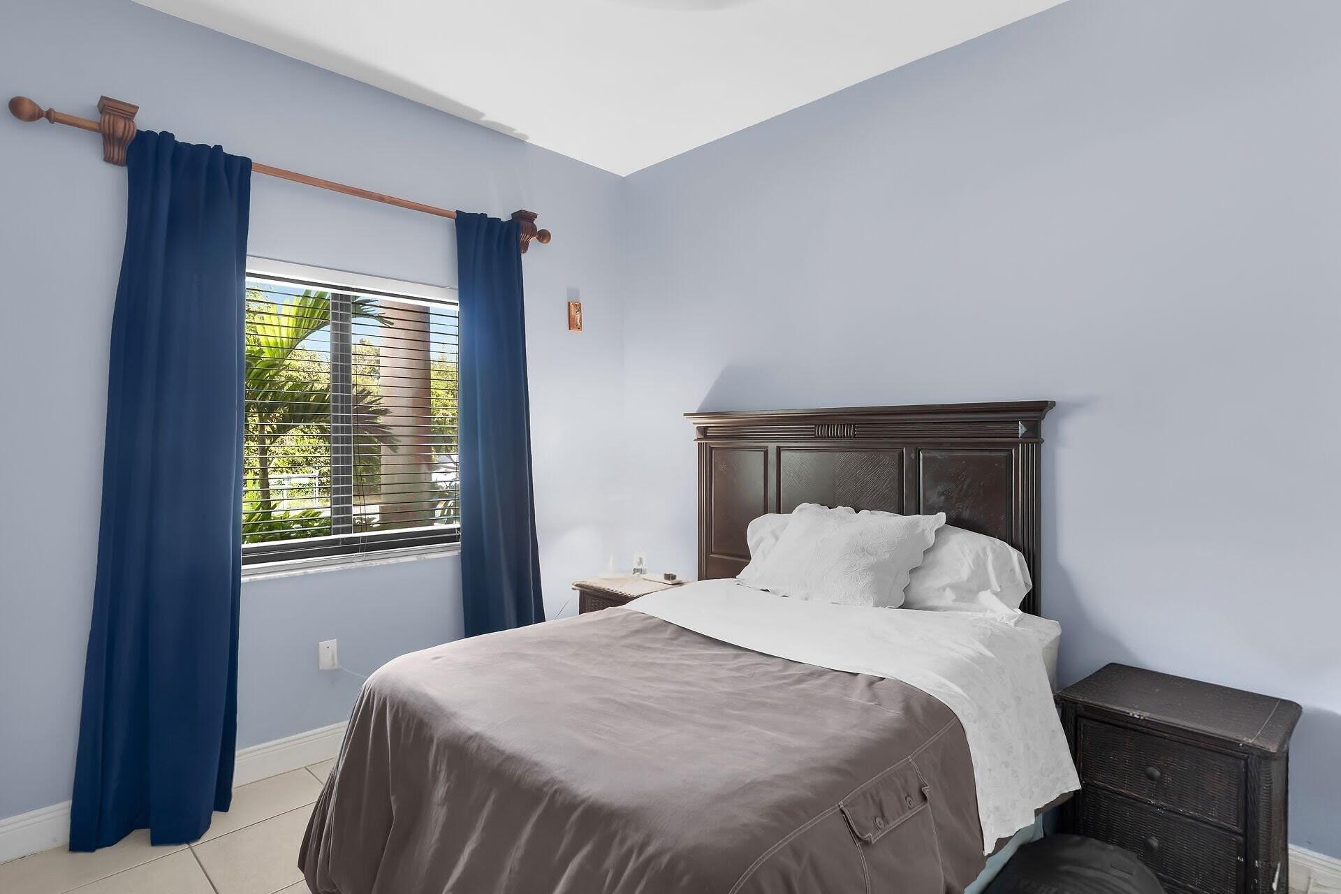 6 Fishermans Trail Key Largo, FL 33037 - Photo 23 of 50 a bedroom with a bed and window
