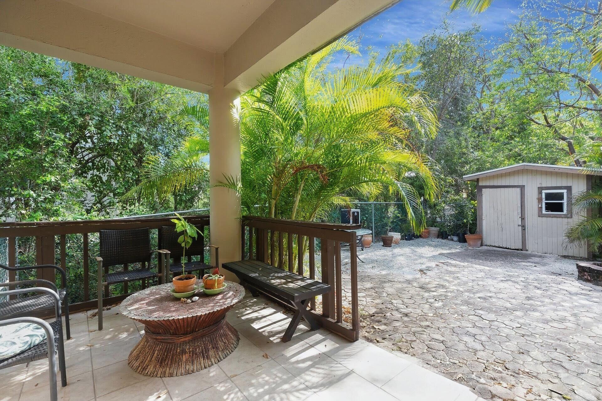 6 Fishermans Trail Key Largo, FL 33037 - Photo 27 of 50 a view of backyard with outdoor seating and plants