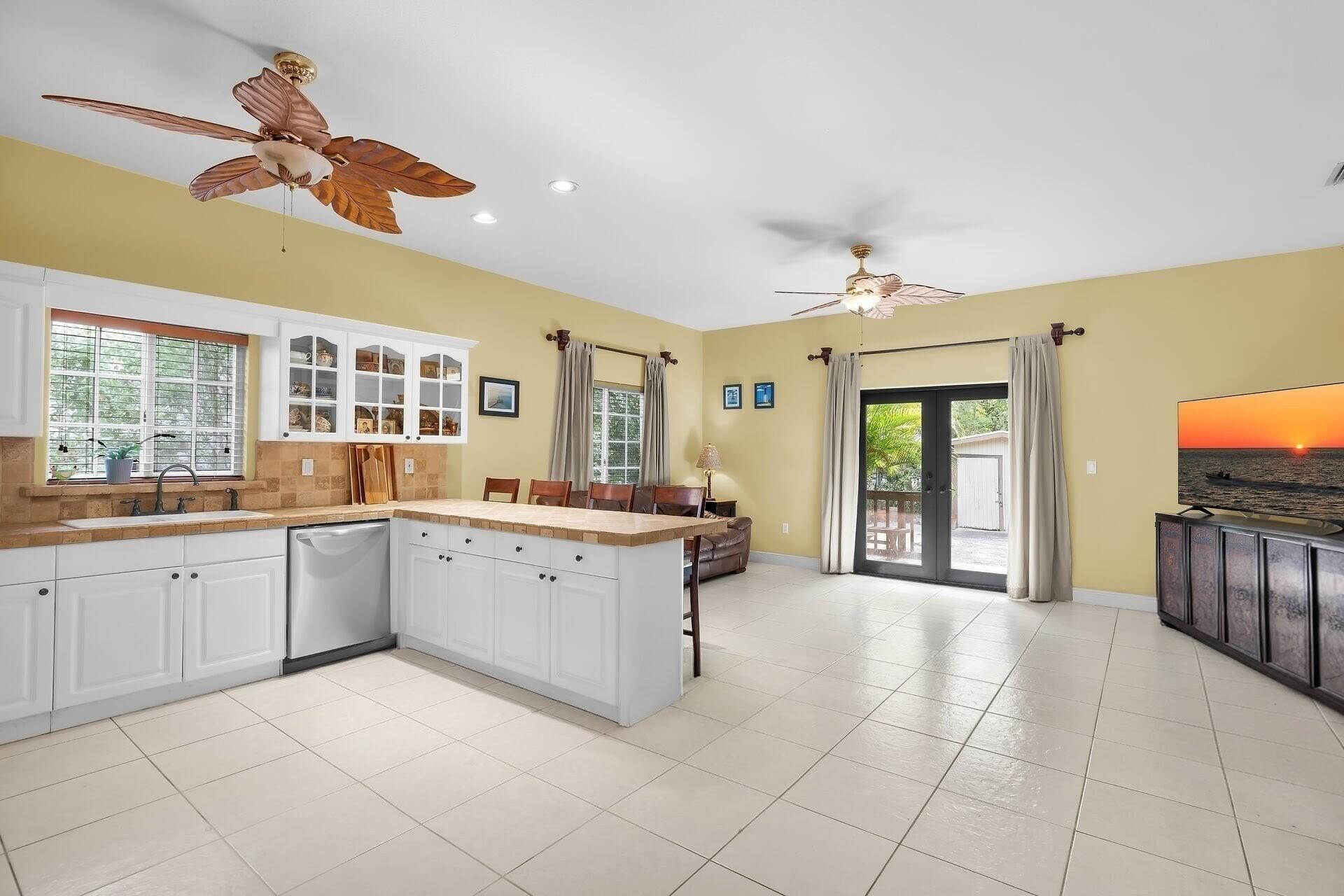 6 Fishermans Trail Key Largo, FL 33037 - Photo 9 of 50 a large white kitchen with a large window