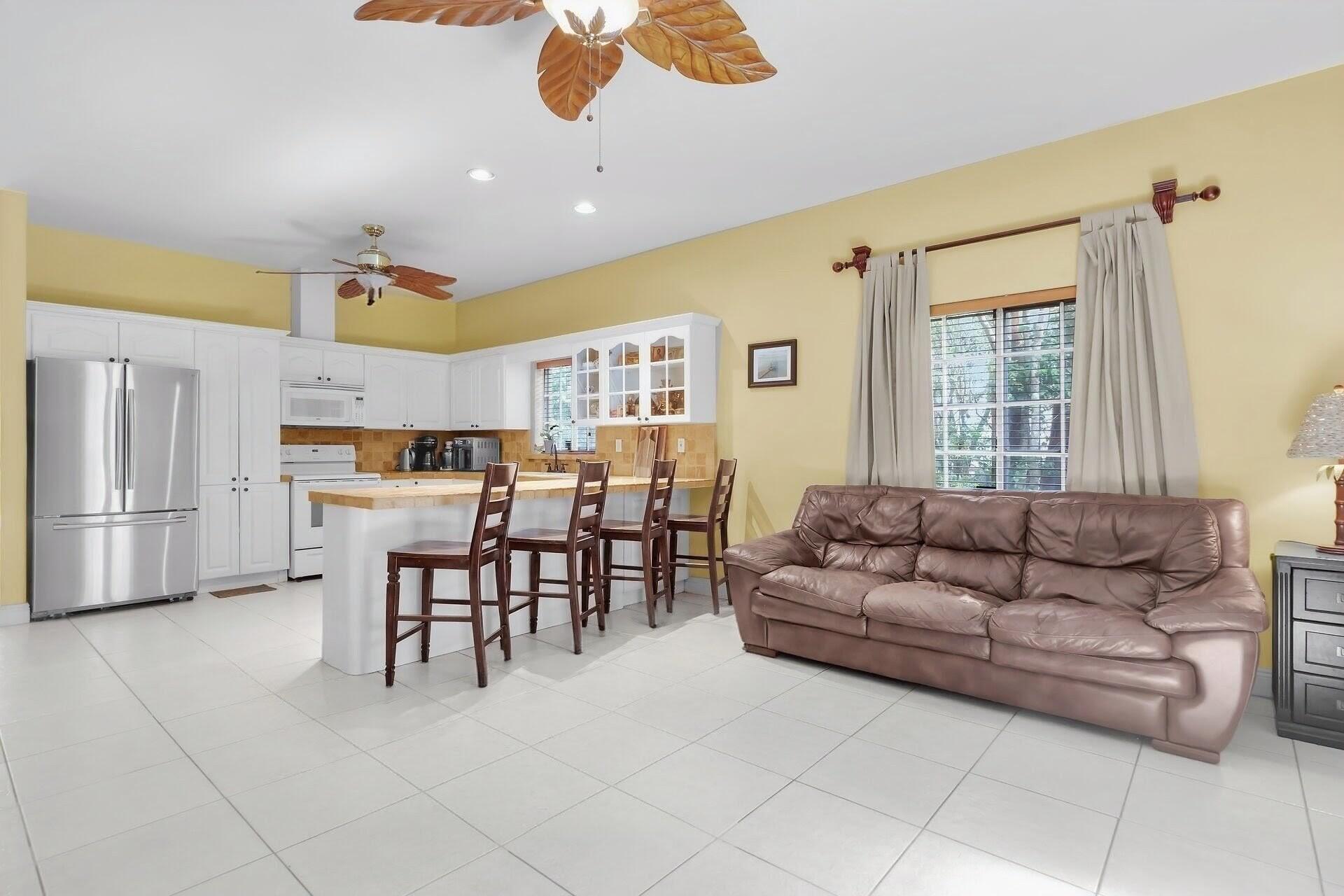6 Fishermans Trail Key Largo, FL 33037 - Photo 10 of 50 a living room with furniture and a dining table with kitchen view