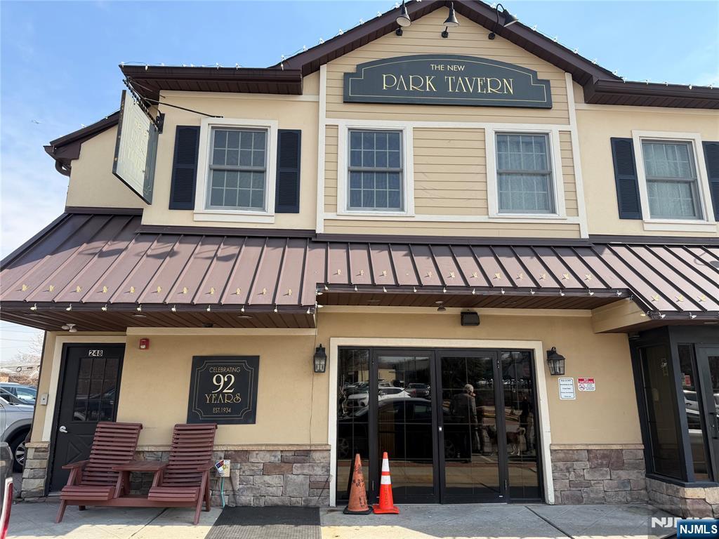 a front view of a brick building with many windows