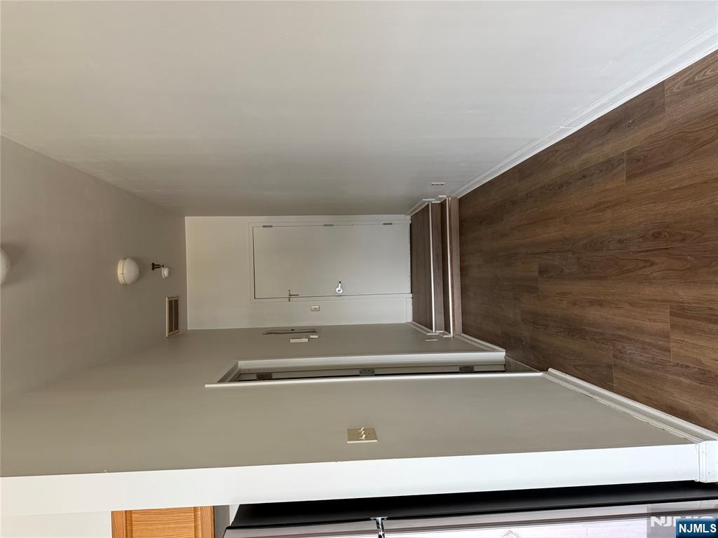 250 Park Avenue, Unit 1 East Rutherford, NJ 07073 - Photo 7 of 8 a view of a hallway with wooden floor