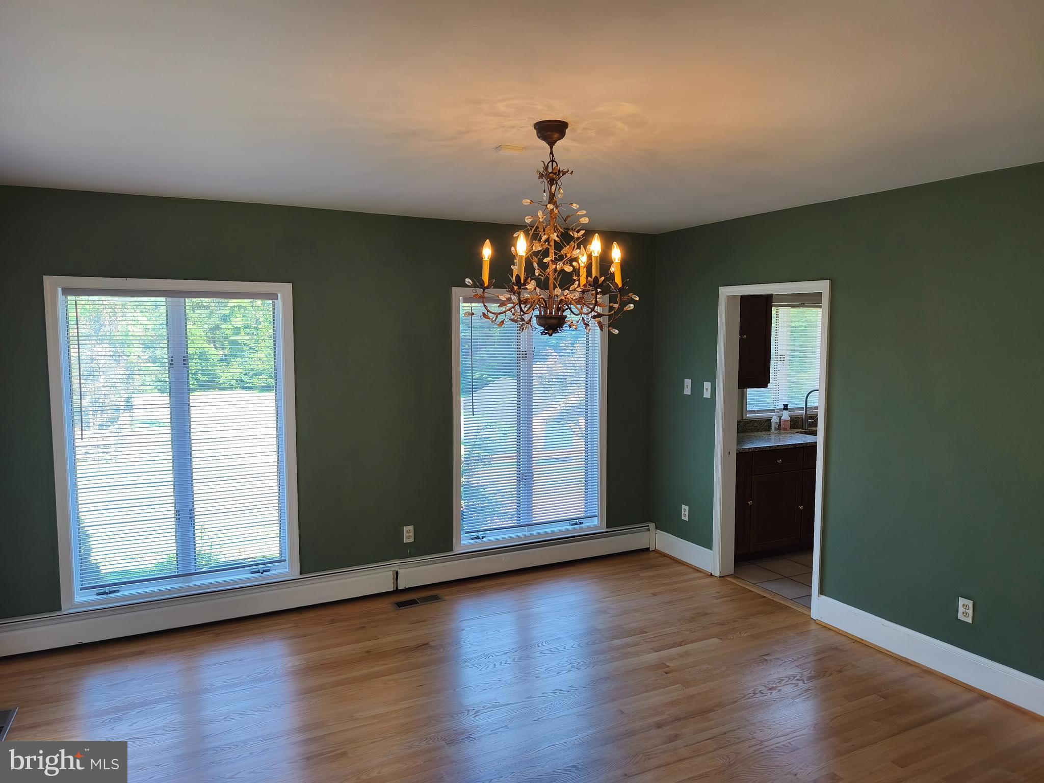 901 Walker Road Great Falls, VA 22066 - Photo 17 of 57 a view of an empty room with wooden floor and a window
