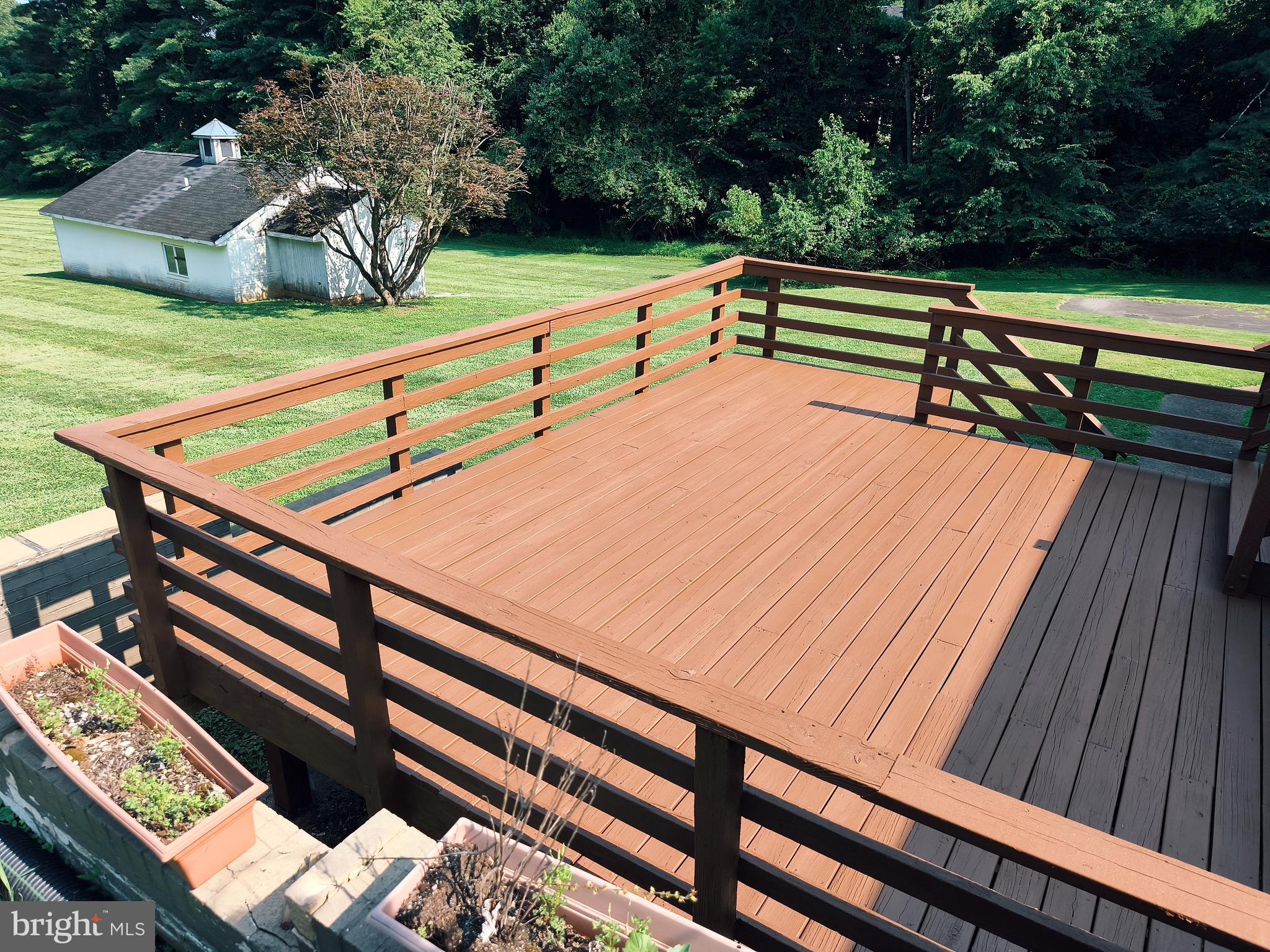 901 Walker Road Great Falls, VA 22066 - Photo 23 of 57 a view of outdoor space and deck