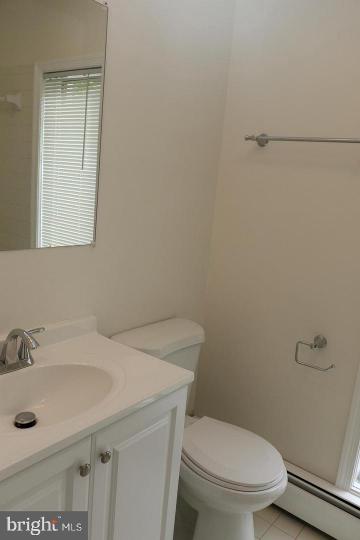 901 Walker Road Great Falls, VA 22066 - Photo 30 of 57 a bathroom with a sink a toilet and a mirror