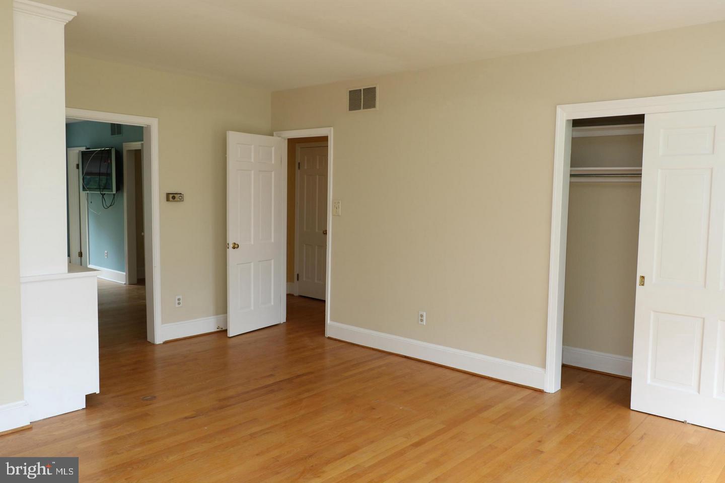 901 Walker Road Great Falls, VA 22066 - Photo 36 of 57 an empty room with wooden floor and closet