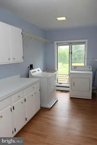 a white toilet sitting next to a shower