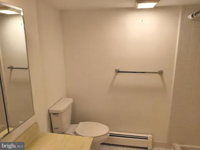 a view of a green field with wooden fence