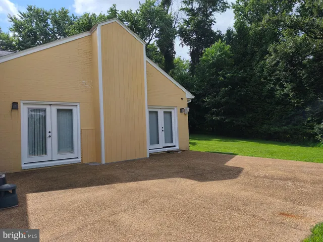 a view of a swimming pool and a yard