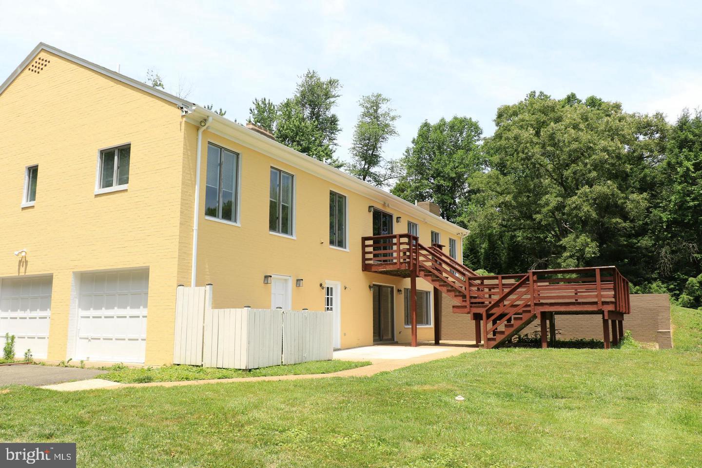 901 Walker Road Great Falls, VA 22066 - Photo 54 of 57 a front view of a house with a yard