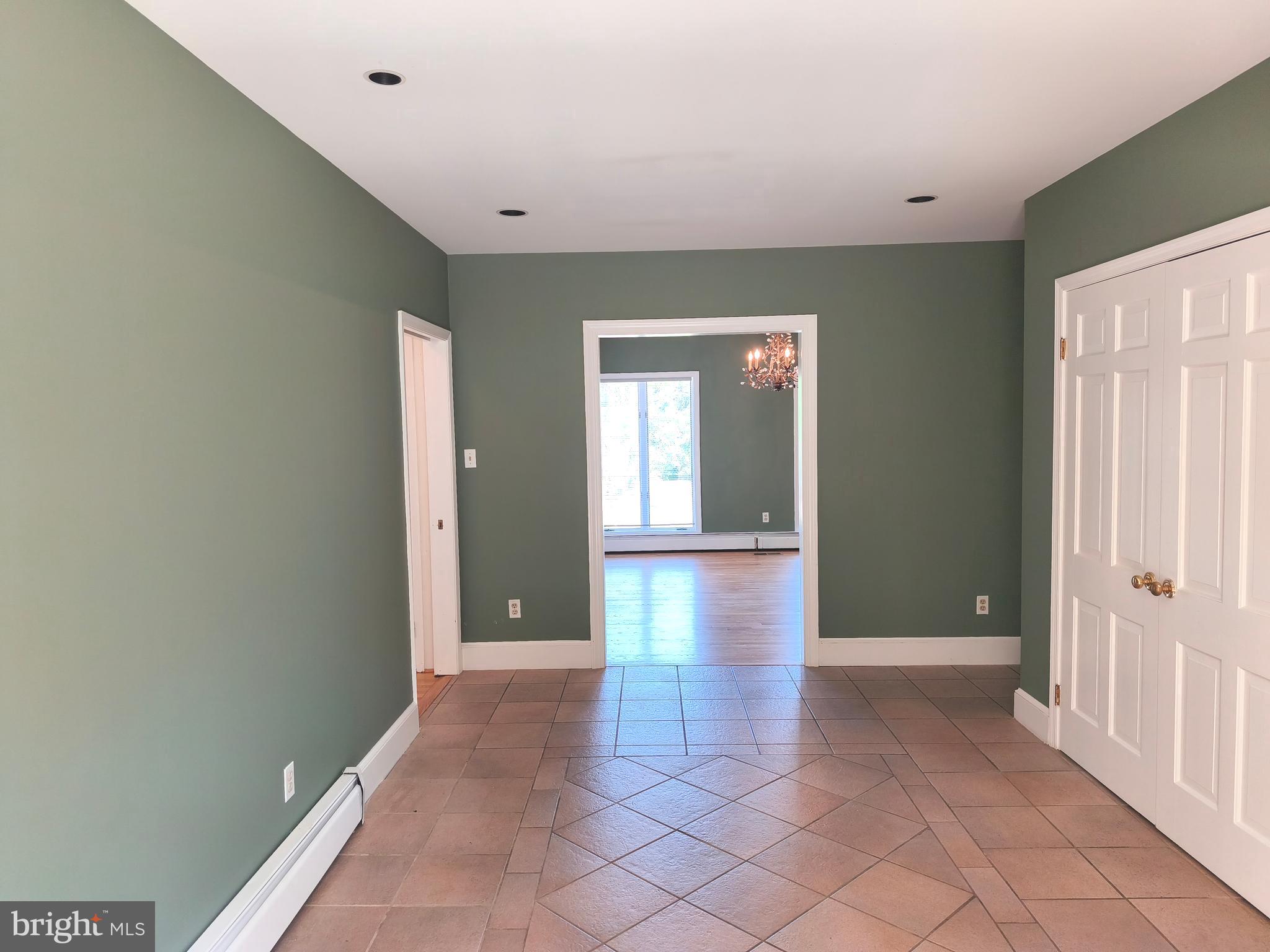 901 Walker Road Great Falls, VA 22066 - Photo 6 of 57 a view of a hallway with wooden shelves