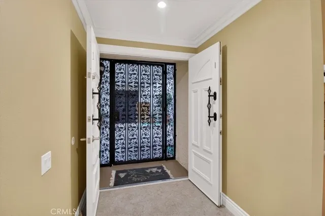 a view of entryway with a small yard