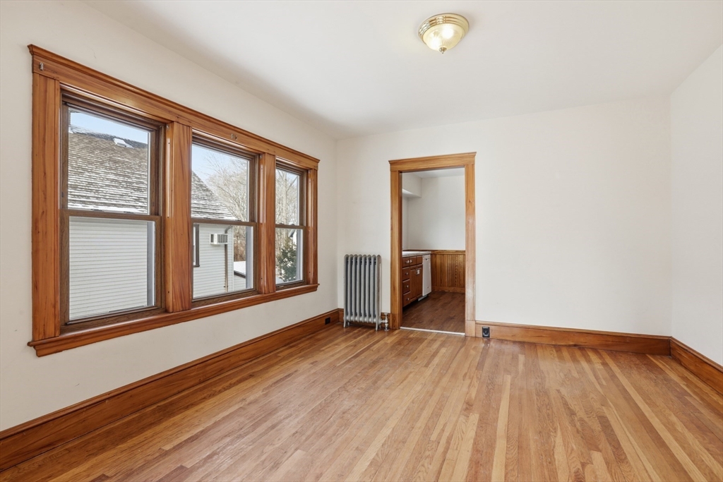 67 Lake Street, Unit 2 Arlington, MA 02474 - Photo 8 of 16 a view of an empty room with glass door