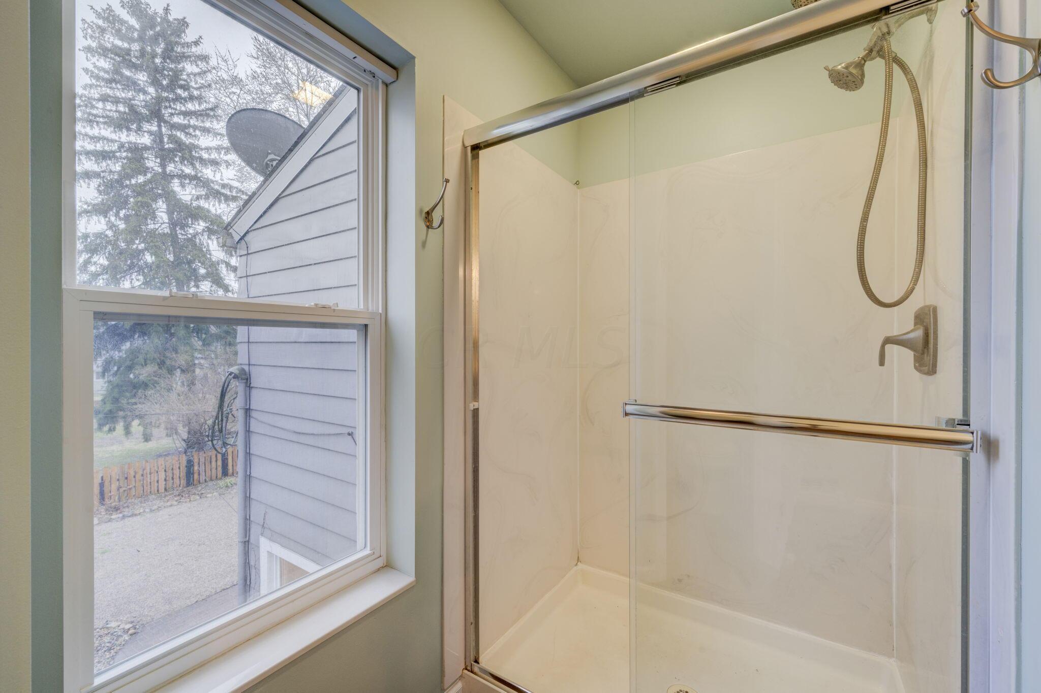 621 Garden Road Columbus, OH 43214 - Photo 27 of 38 Owner Suite Bathroom Shower and Backyard