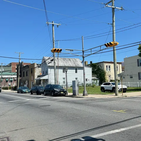 a view of a street with cars
