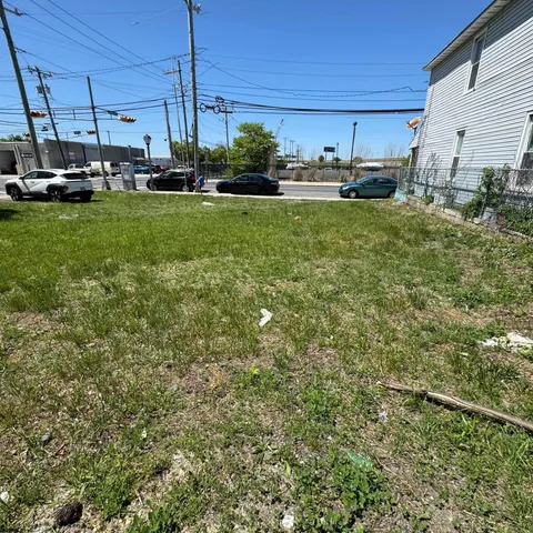 a view of a kitchen with a sink and a fireplace