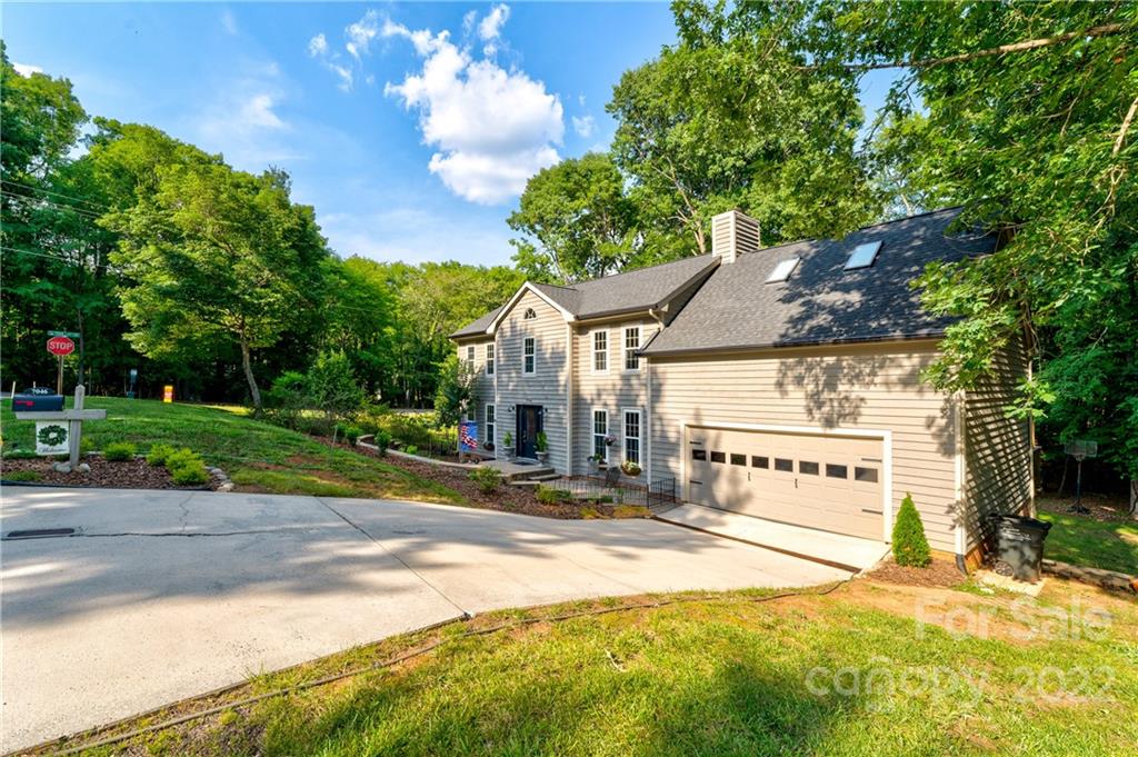 7046 Chelsea Day Lane Tega Cay, SC 29708 - Photo 4 of 36 a view of a house with a yard