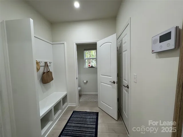 a bathroom with a sink and glass door