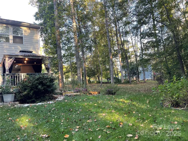 a backyard of a house with lots of green space
