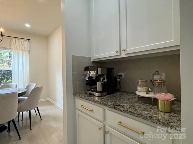 a kitchen with a sink and a large window