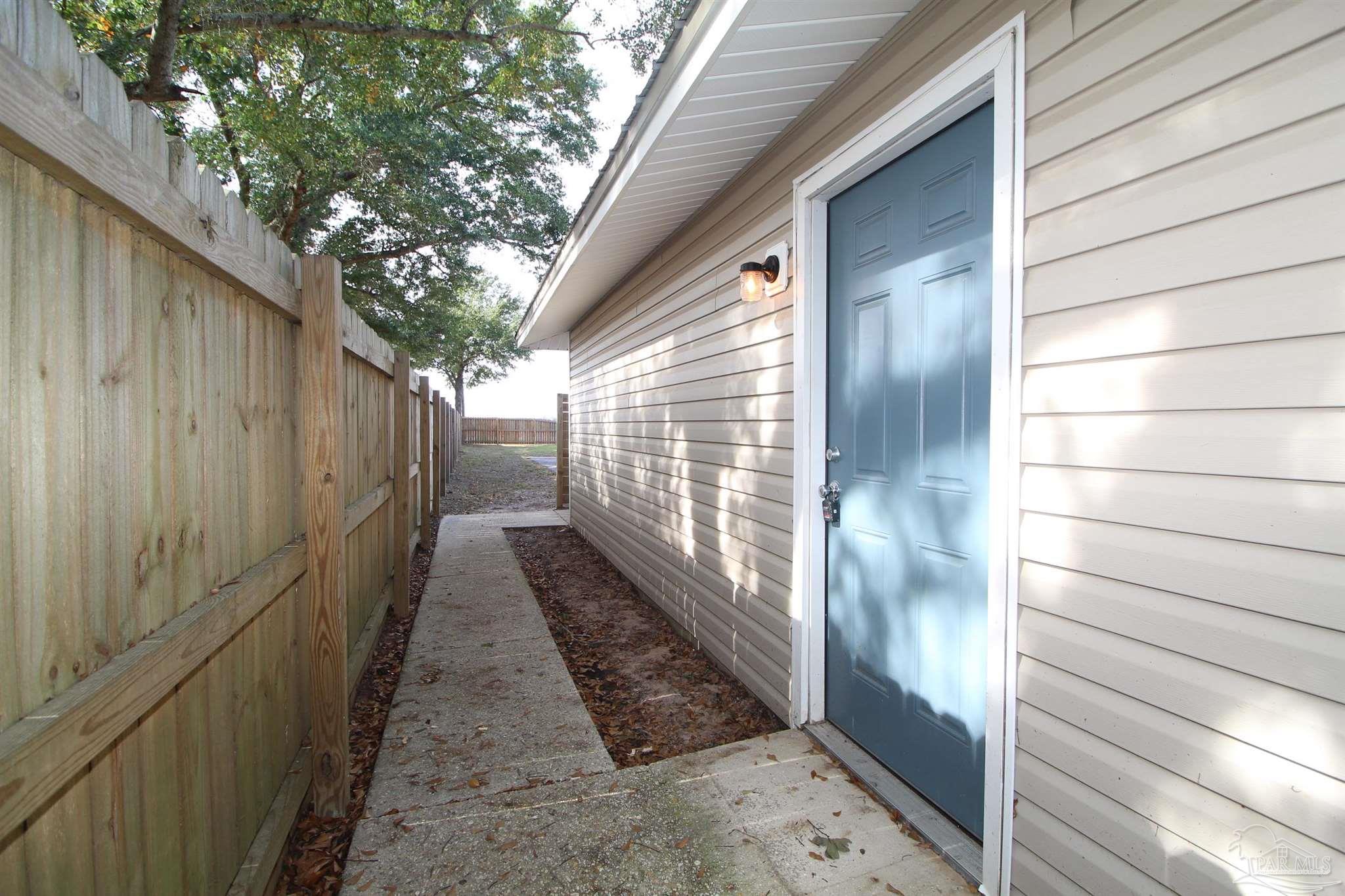 4964 West Spencer Field Road, Unit 6 Pace, FL 32571 - Photo 2 of 15 a view of a pathway
