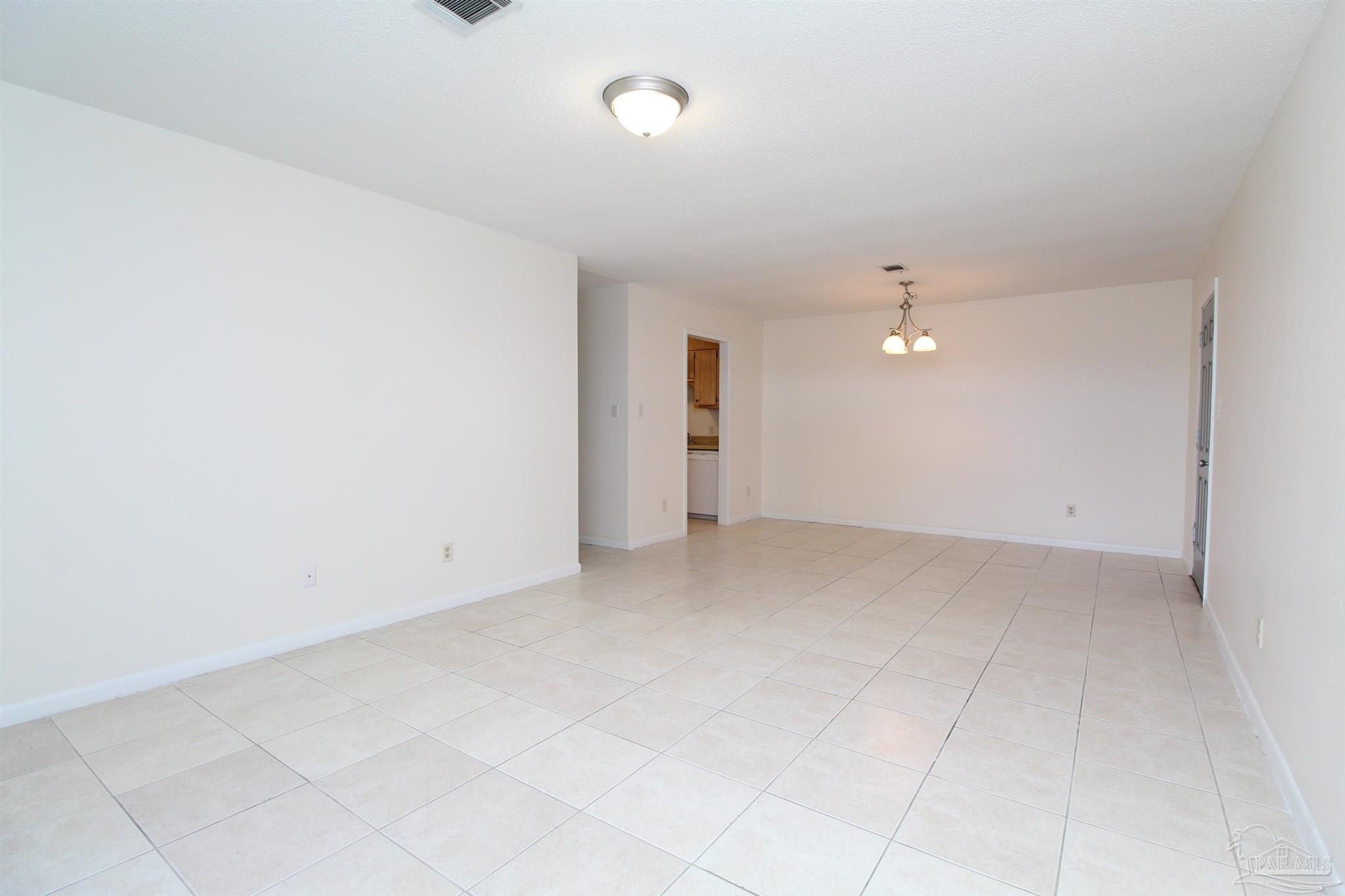 4964 West Spencer Field Road, Unit 6 Pace, FL 32571 - Photo 4 of 15 an empty room with an entryway