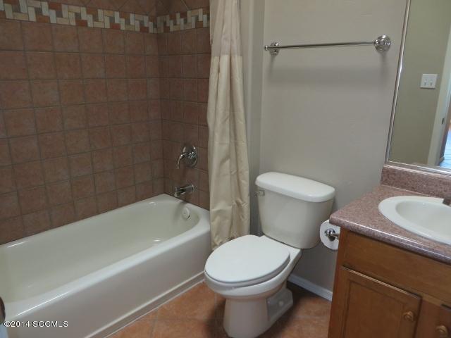 330 Ambrosia Court Rio Rico, AZ 85648 - Photo 23 of 37 a bathroom with a toilet a sink and bathtub