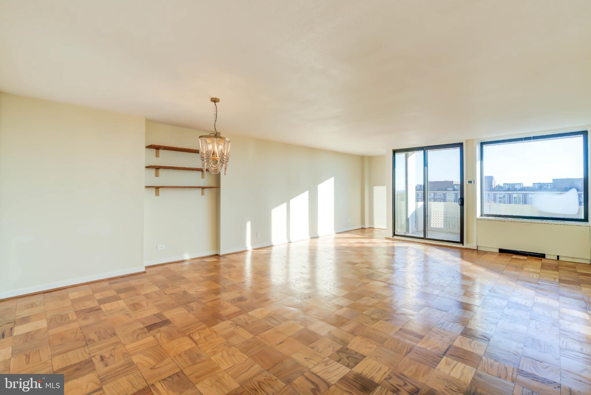 a view of an empty room with a window