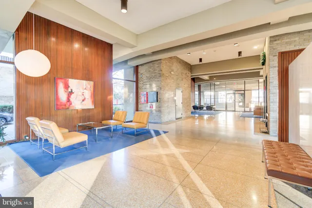 a lobby with furniture and window
