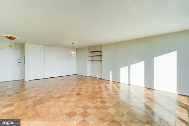 a view of an empty room with windows