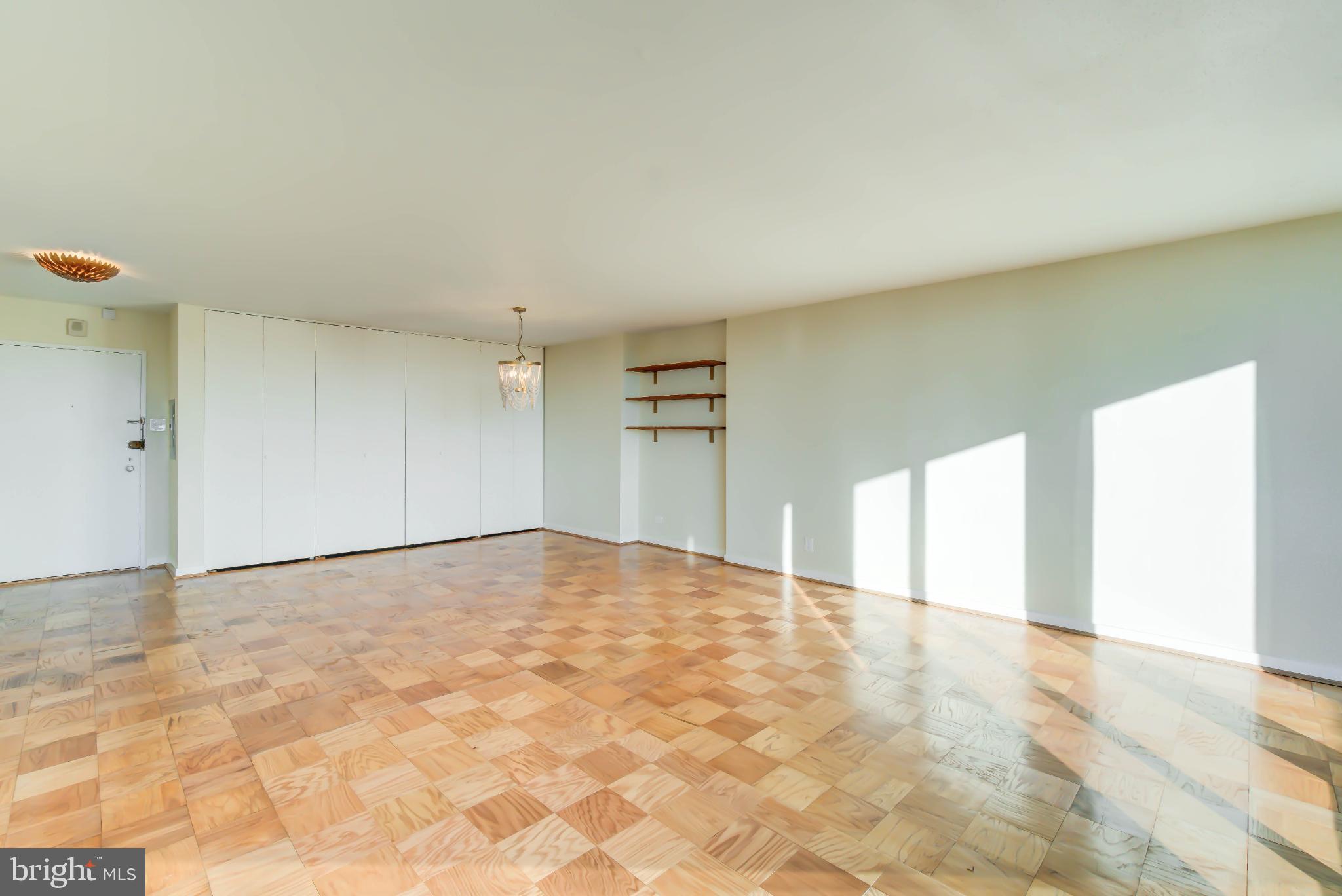 490 M Street Southwest, Unit W800 Washington, DC 20024 - Photo 4 of 21 a view of an empty room with windows