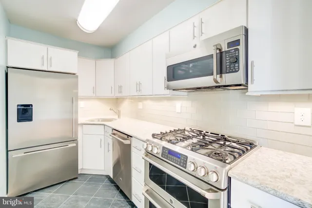 a kitchen with a stove and a microwave