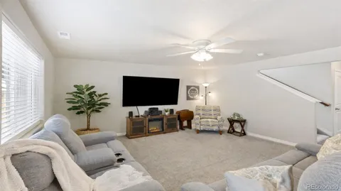 a bathroom with a granite countertop sink a mirror and a window