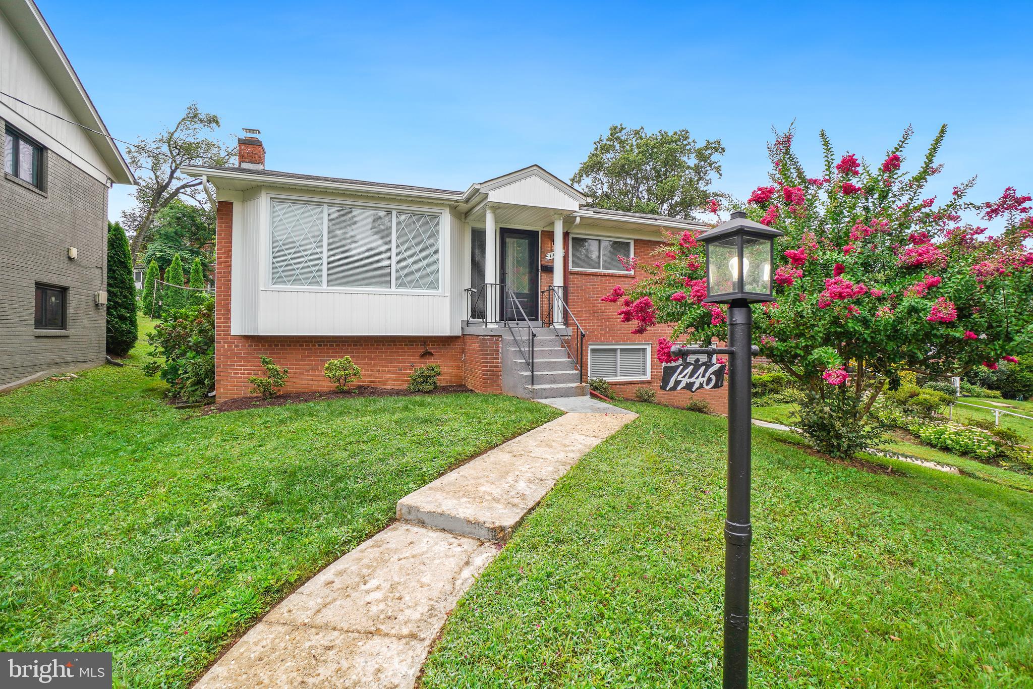 a view of an house with backyard space and garden